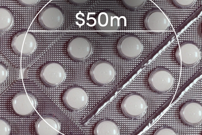 Pill pack with text overlaid: $50m