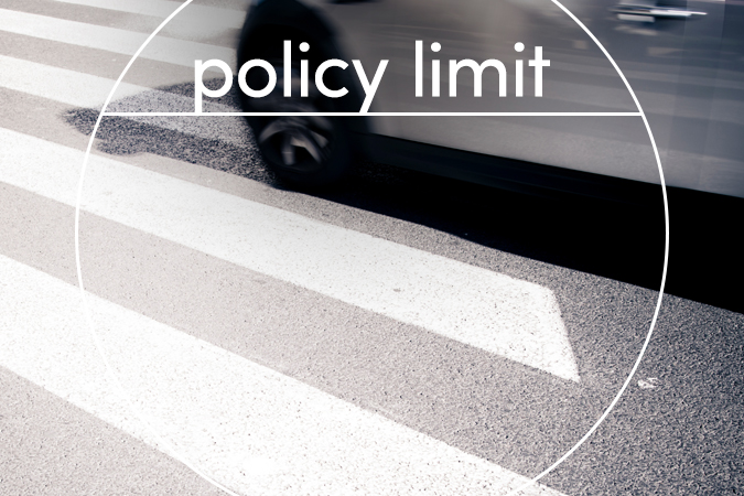Car driving over crosswalk with text overlaid: Policy Limit