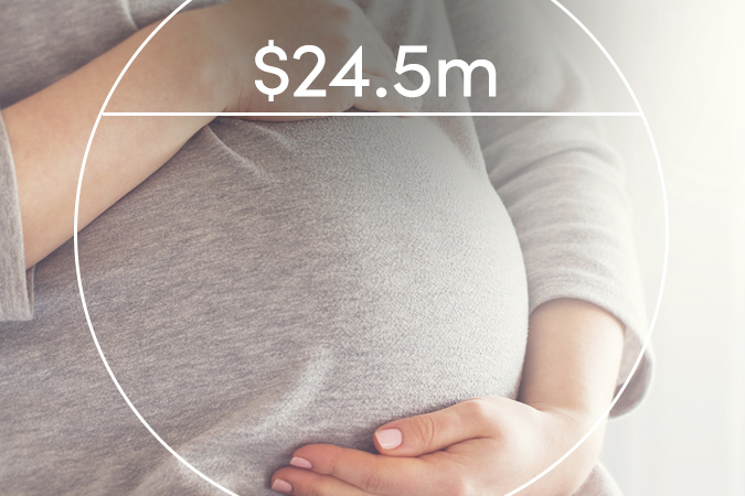 Woman holding pregnant belly with text overlaid: $24.5m