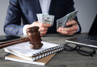  black-woman-pointing-document-near-lady-with-pen-table-with-calculator-gavel